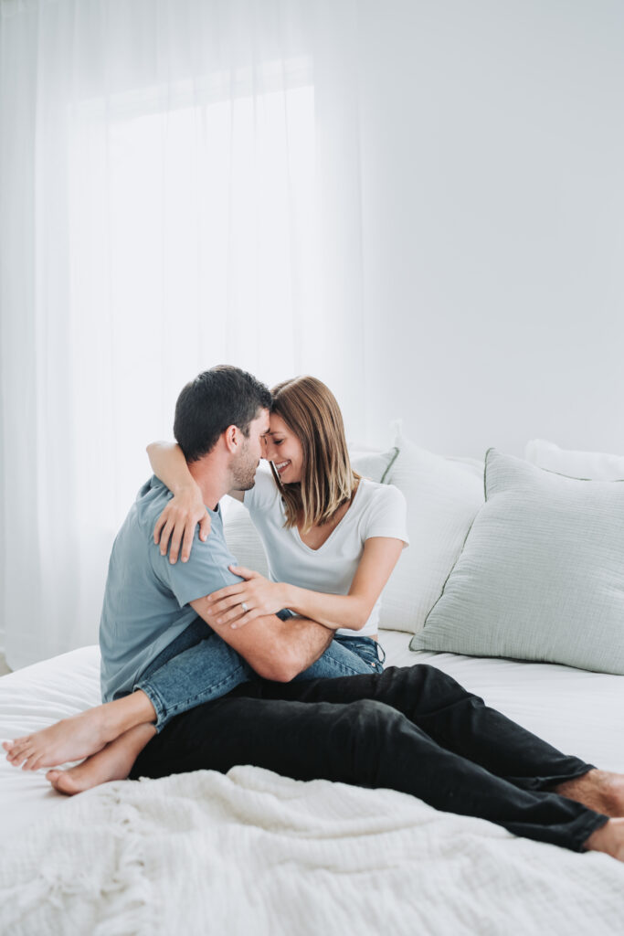 couple embrace on bed