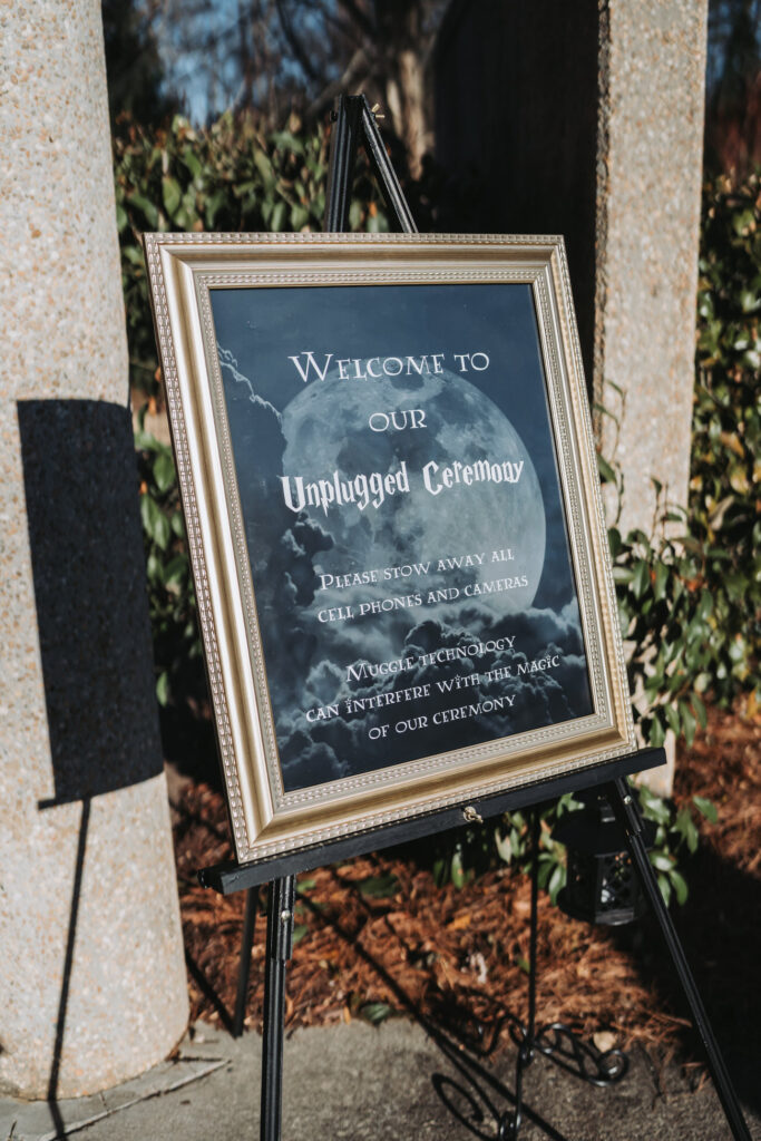 Harry Potter inspired Unplugged ceremony sign and decorations.