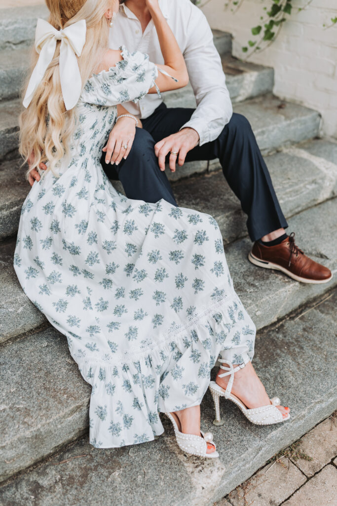 Girl's engagement outfit has heels with pearls and a flower patterned dress. Engagement photos at Serenbe.