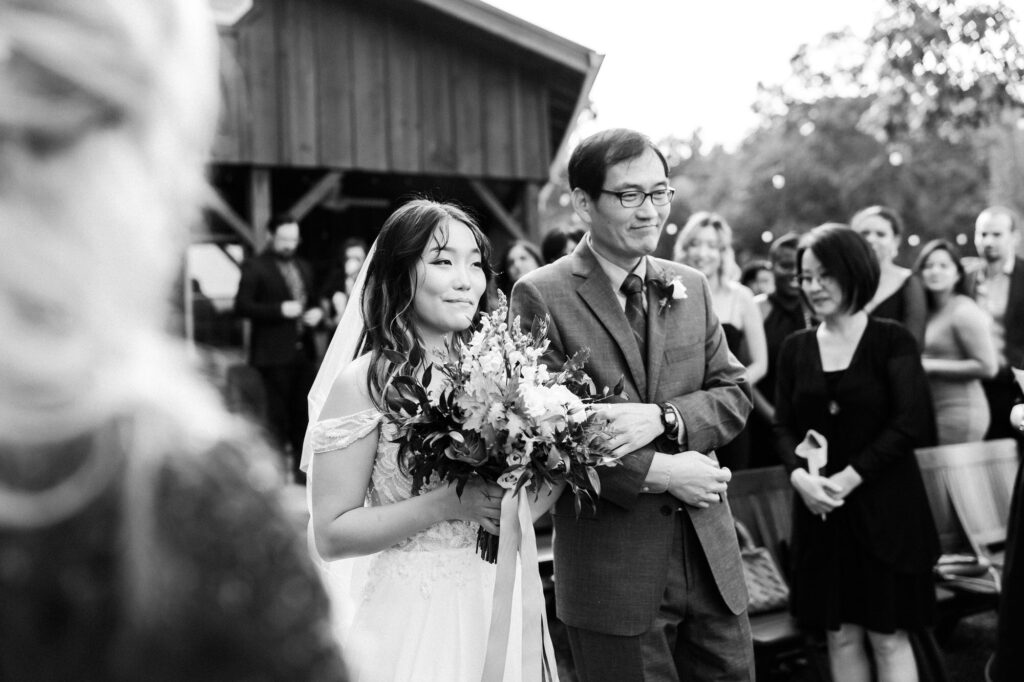Father walking bride down the aisle. Wedding at Flat Rock Farms.