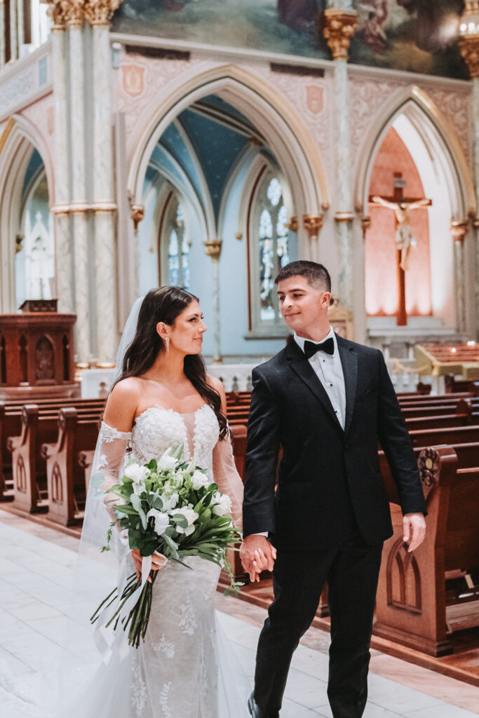 Bride and groom after wedding ceremony at Cathedral Basilica of St. John the Baptist.