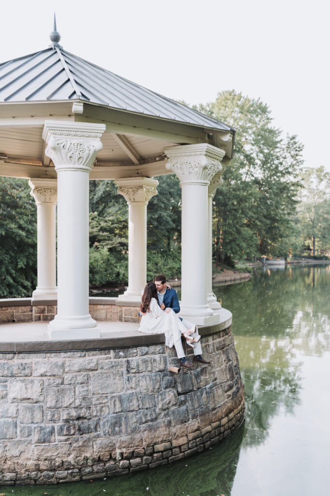 Couple holds one another during their Piedmont Park Engagement Photoshoot.