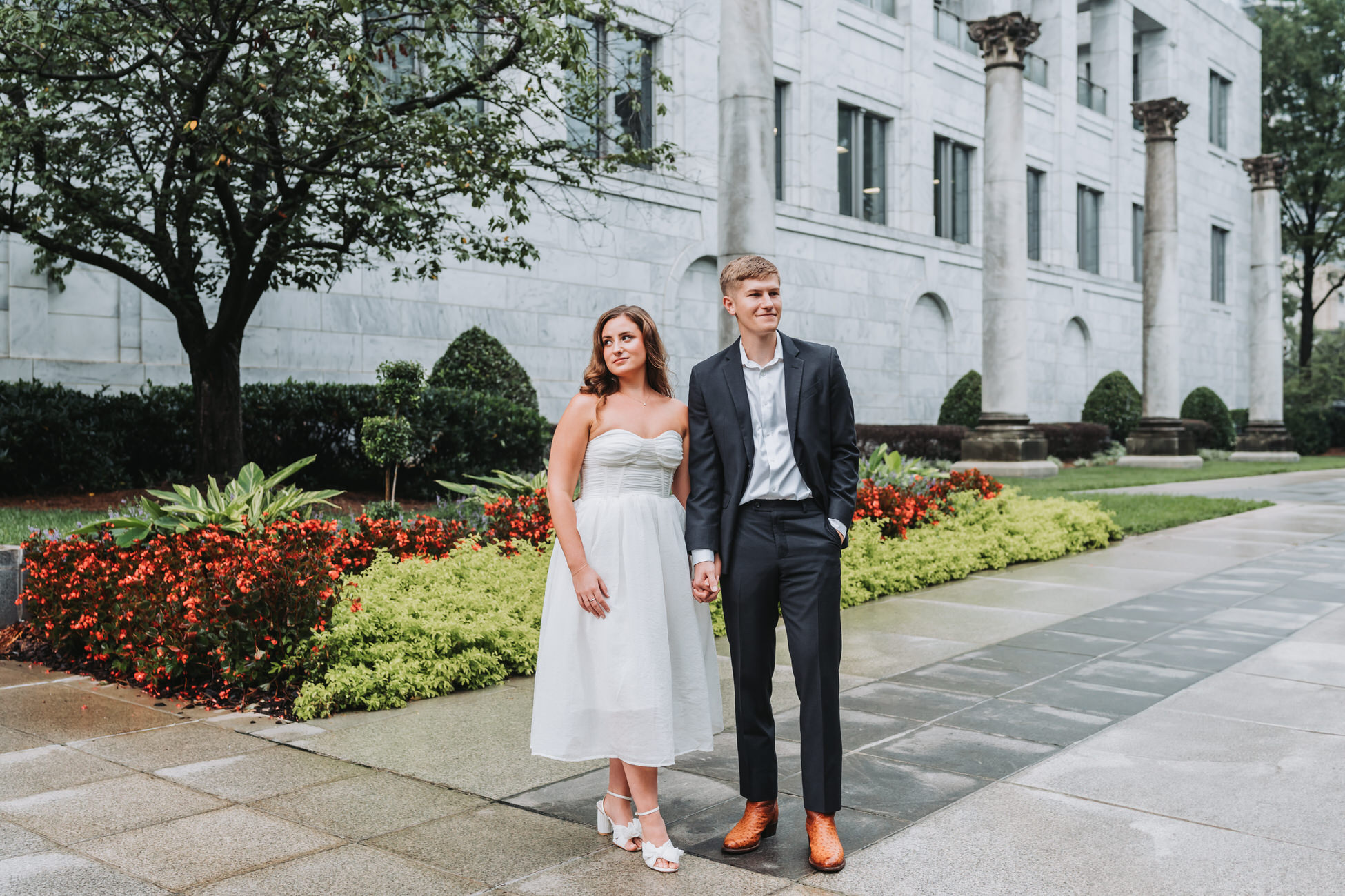 Man and woman hold hands during their Atlanta engagement session