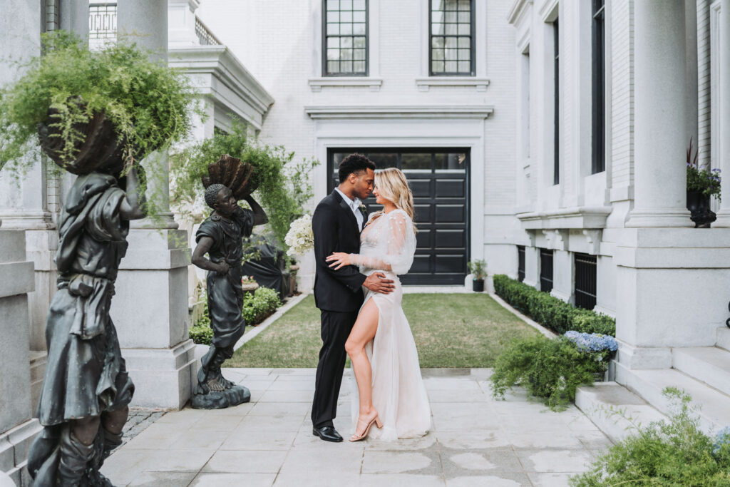 Bride and groom touch foreheads at Armstrong Kessler Mansion wedding venue in Savannah Georgia.
