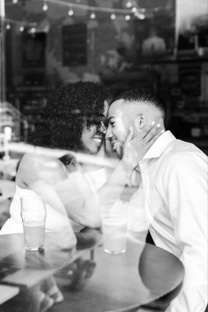 engaged couple having a drink at a restaurant