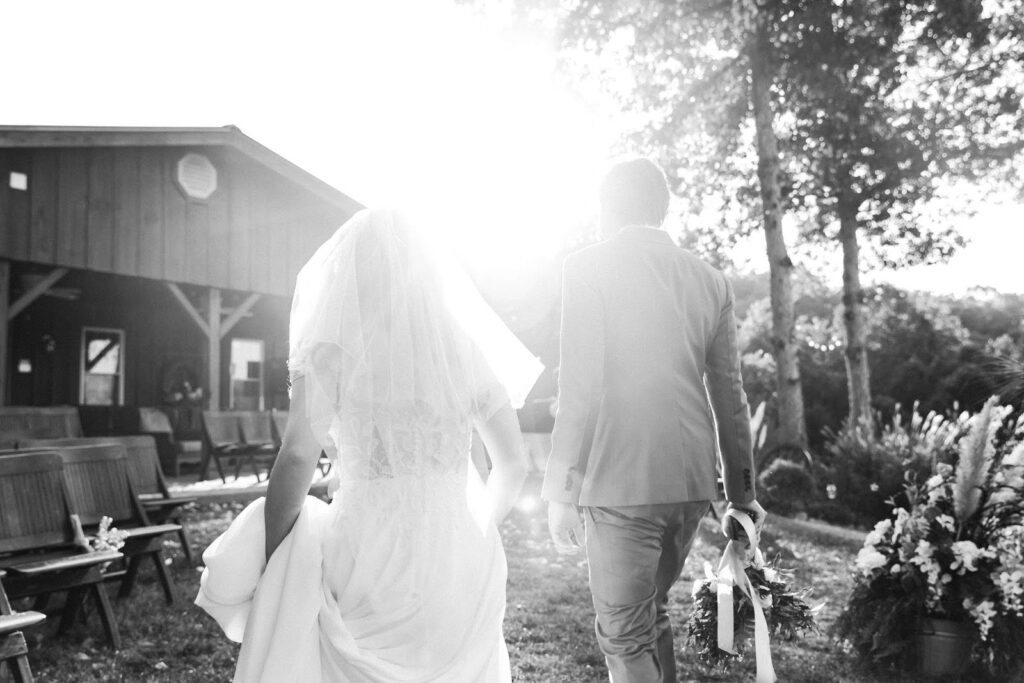 bride and father walking photo in black and white