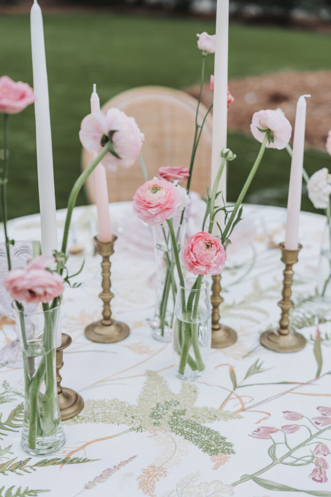 Colorful wedding table with pink flowers.