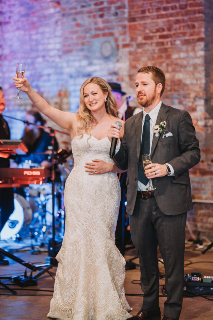 Bride cheers during toast