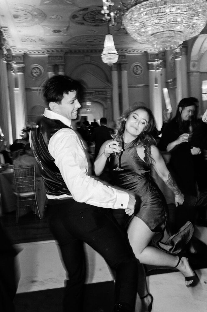 guy and girl dance during wedding reception