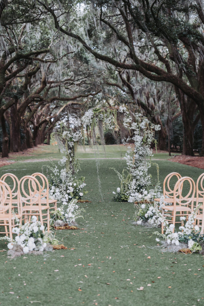 Legare waring house wedding ceremony with organic greenery and spanish moss