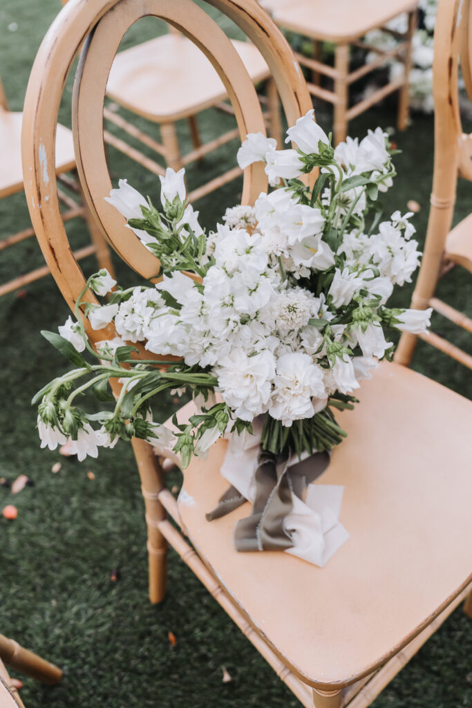 floral bouquet on wooden chair