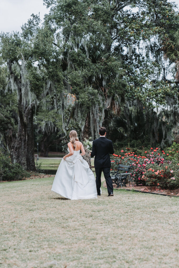 Bride and groom walk around at Legare Waring House