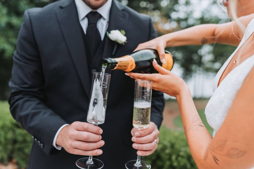 wedding champagne being poured into glasses at outdoor Atlanta wedding