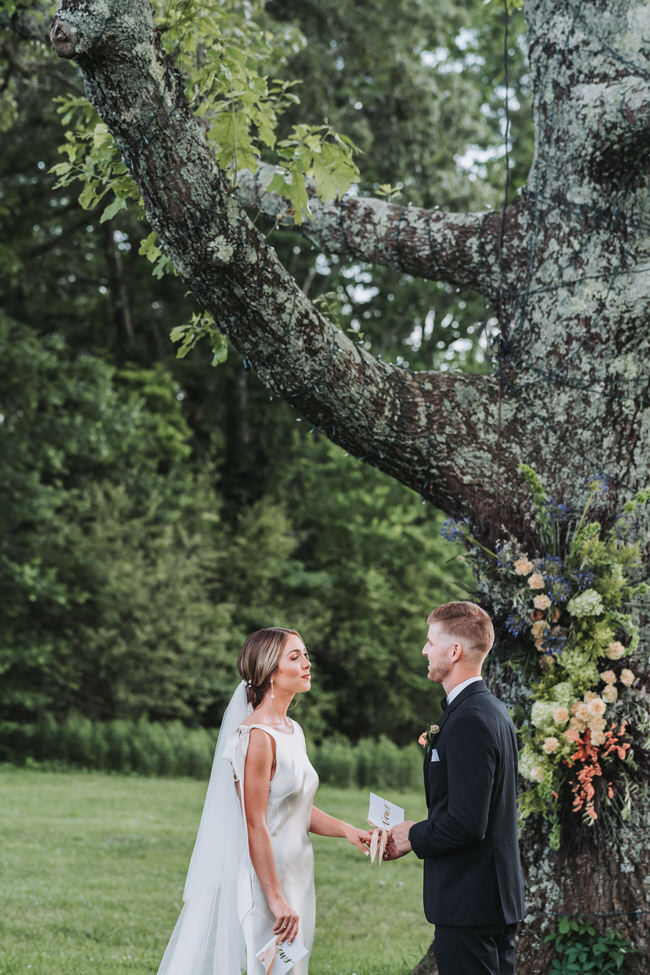 bride and groom read their vows during their ceremony