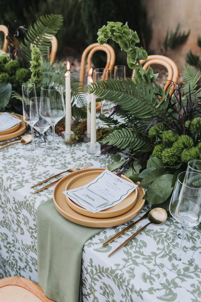 wedding reception table with organic greenery. 