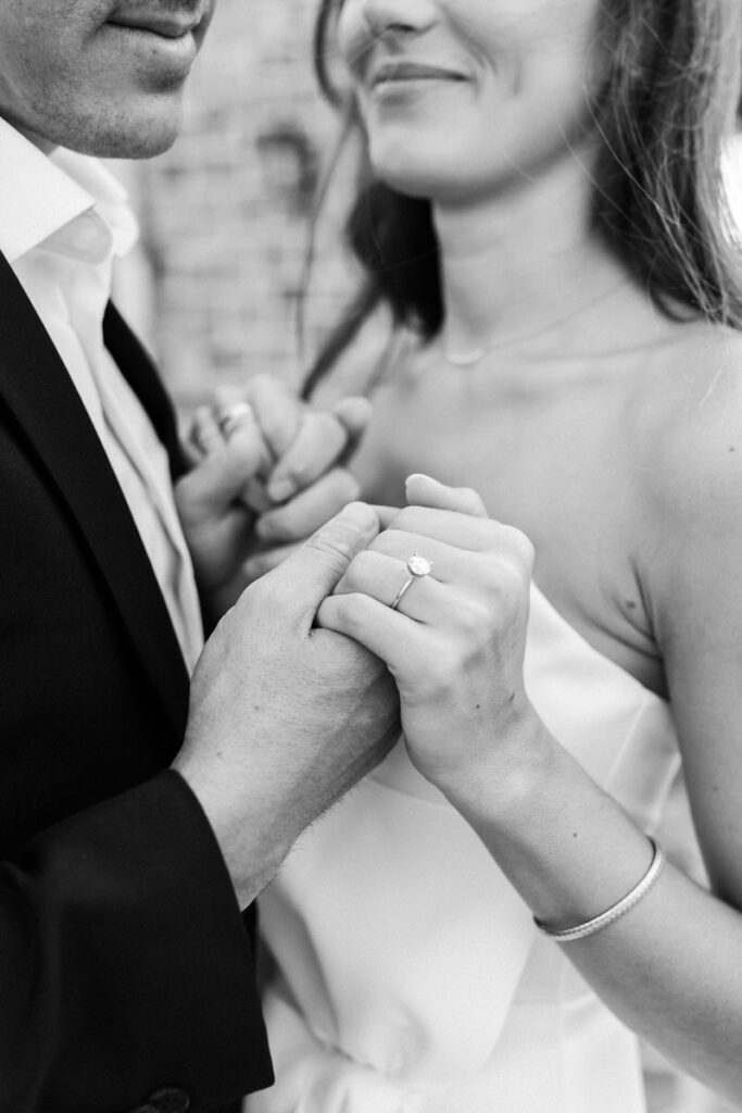 black and white of guy holding girls hand