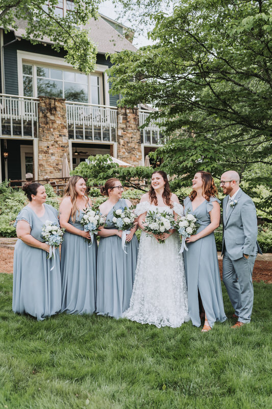 bride looks at her bridesmaids