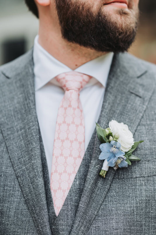 up close photo of groom's boutonniere