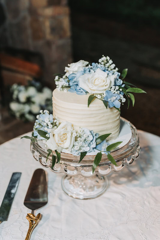 Small wedding cake with blue flowers