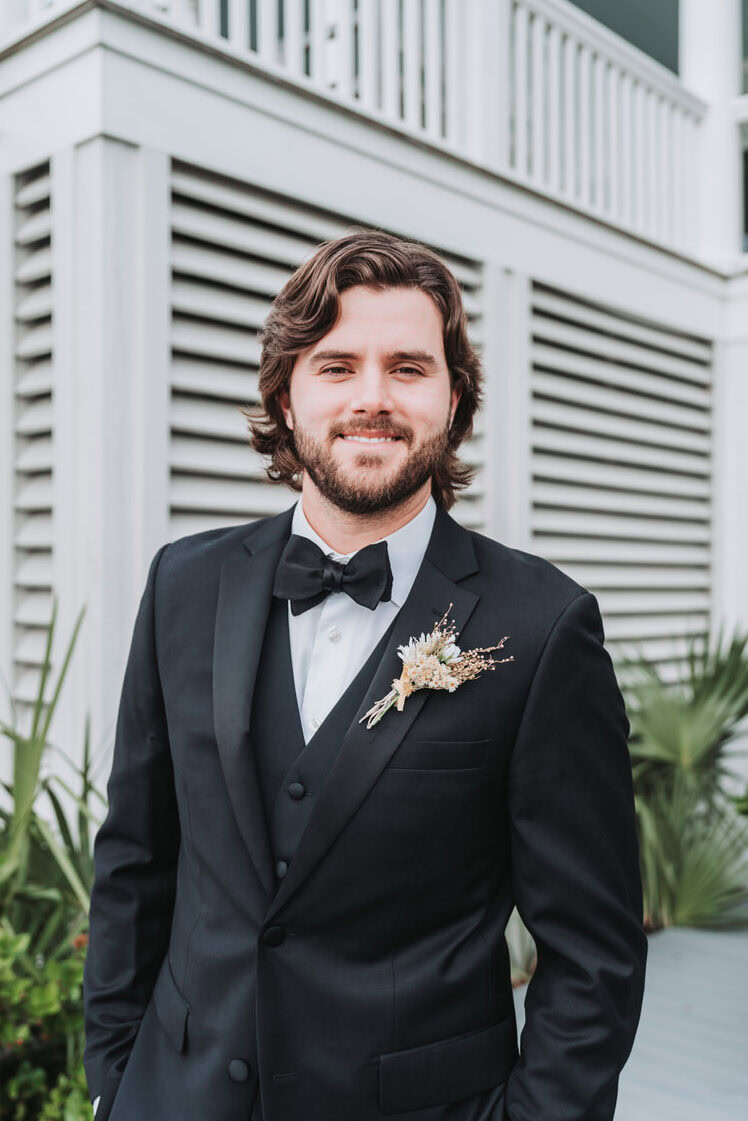 groom smiles at camera