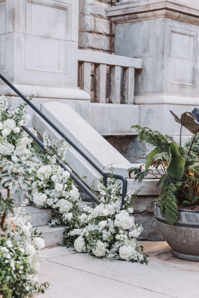 Florals lining the grand staircase at Historic Dekalb Courthouse