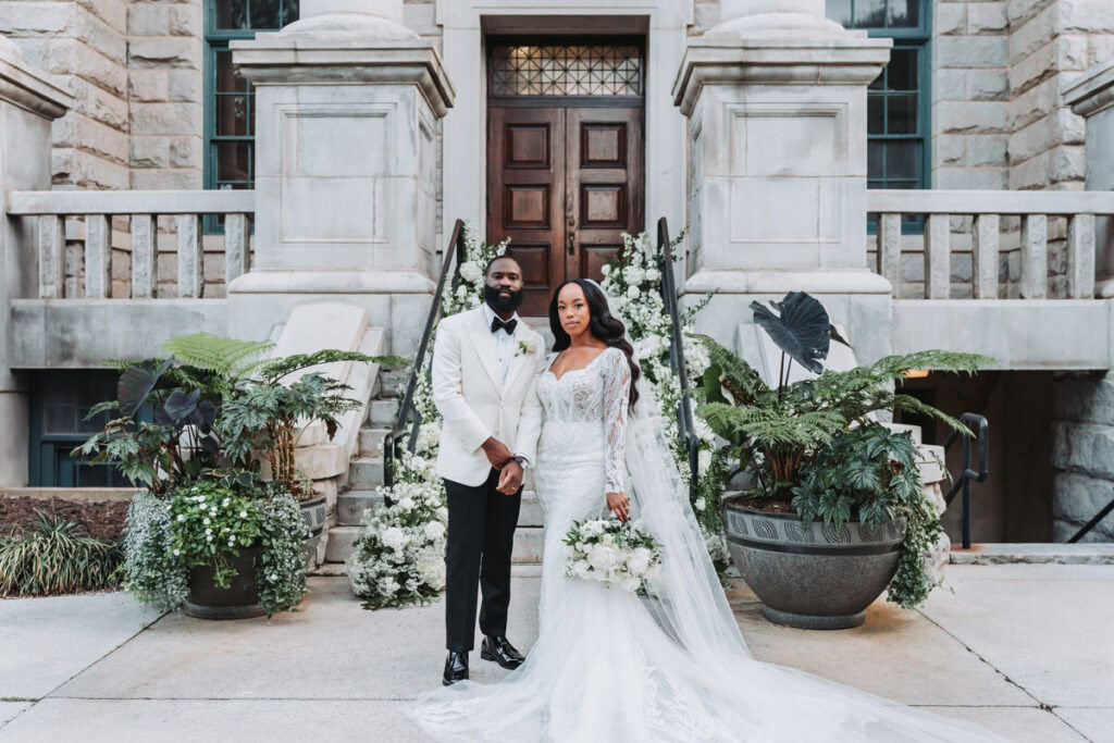 Bride and groom portraits on the grand staircase at Historic Dekalb Courthouse