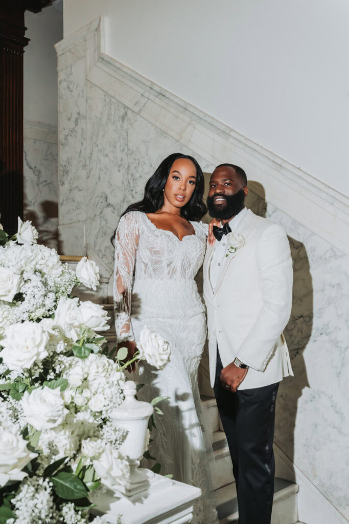 Bride and groom portraits on the interior staircase at Historic Dekalb Courthouse