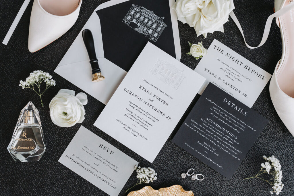 Wedding stationary details with custom invitations featuring the dekalb courthouse